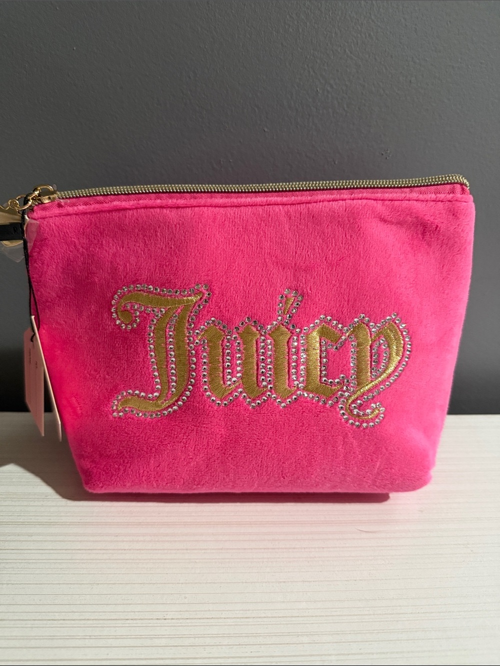 Juicy cosmetic bag with travel toiletry bottle